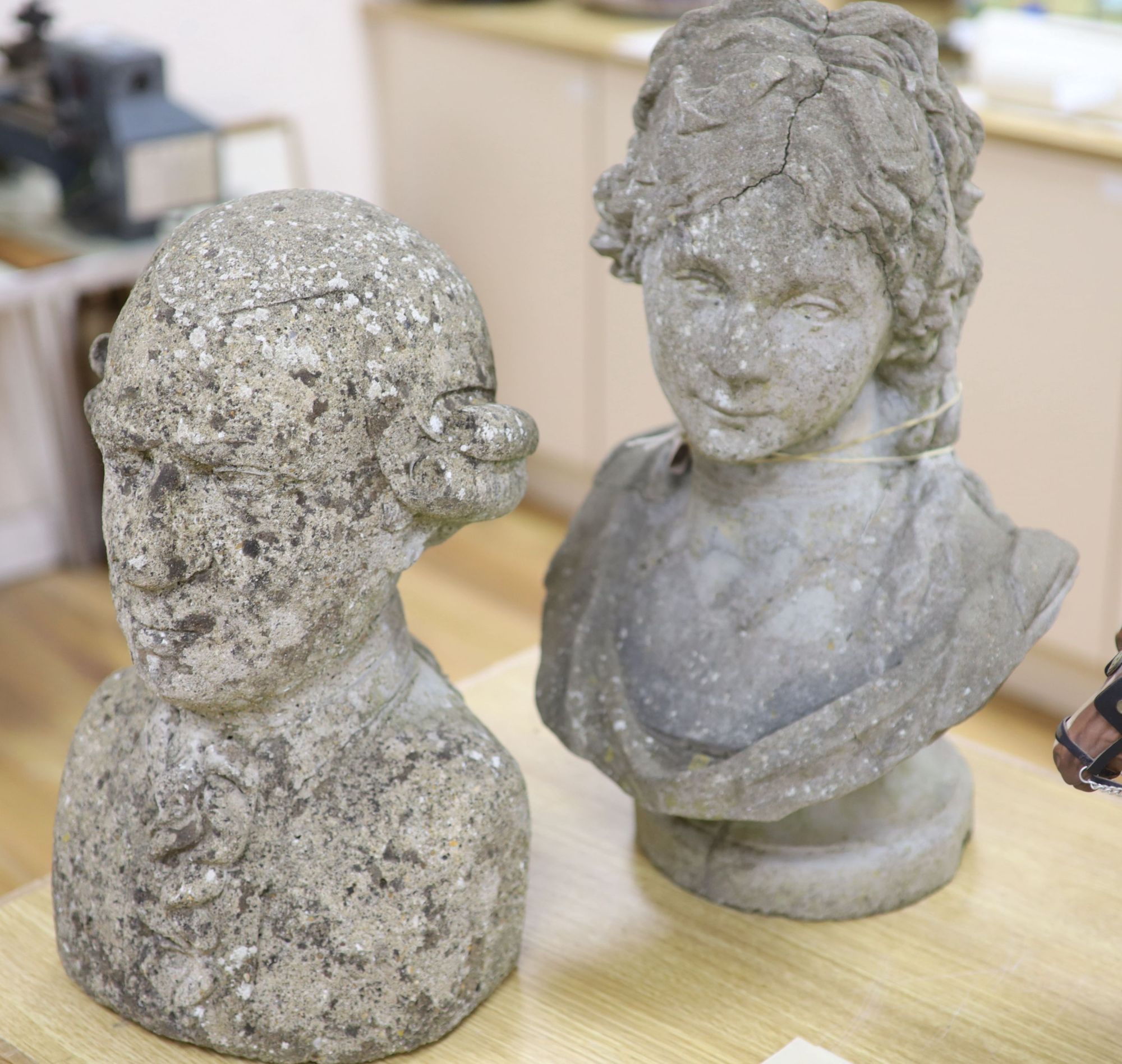 Two reconstituted stone busts, tallest 51cm